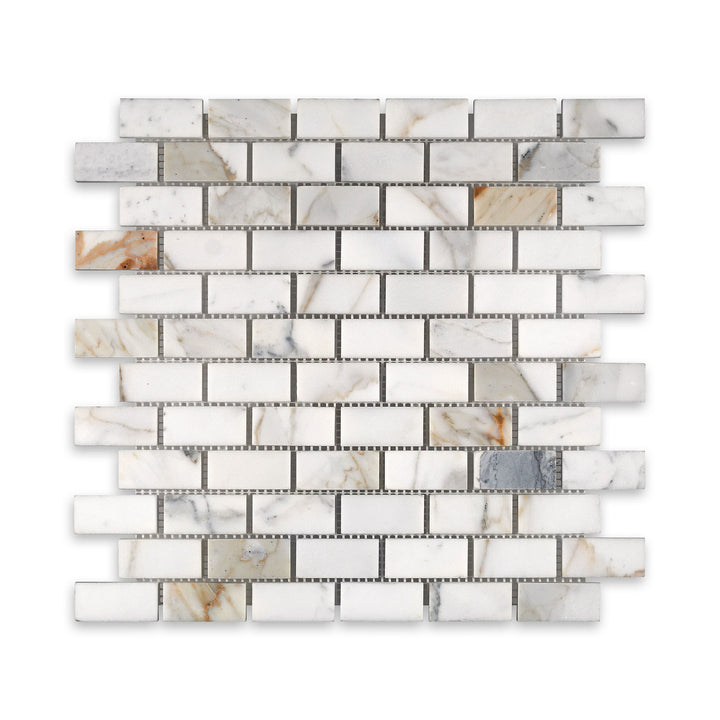 Honed 1x2 brick mosaic in Calacatta Gold Marble seen from above, showcasing natural white marble with subtle golden streaks in a timeless layout.