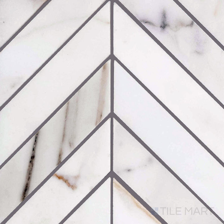 Overview of Calacatta Gold marble chevron polished mosaic tile, with striking V-shaped pattern and dramatic golden veining.