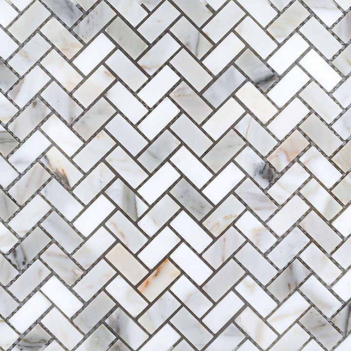 Overview of Calacatta Gold Marble 5/8x1-1/4 herringbone honed mosaic with intricate layout and soft natural finish.