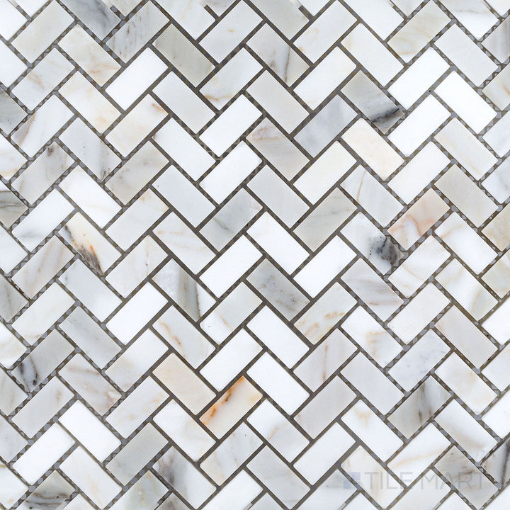Calacatta Gold marble 5/8x1-1/4 herringbone polished mosaic tile shown in layout, presenting a refined zigzag design with classic white-and-gold tones.
