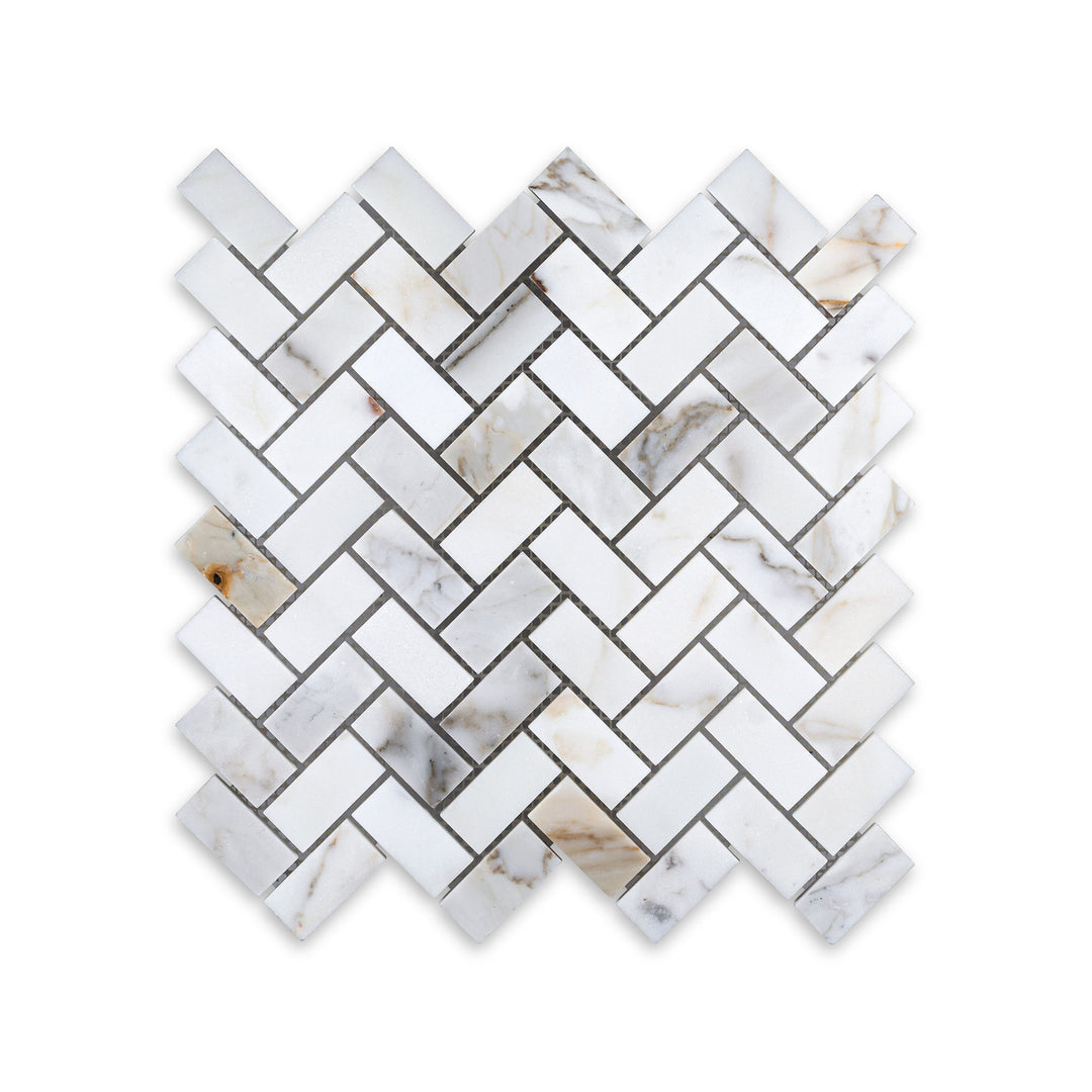Honed Calacatta Gold Marble 1x2 herringbone mosaic seen from a top-down perspective, featuring refined angles and soft natural veining.