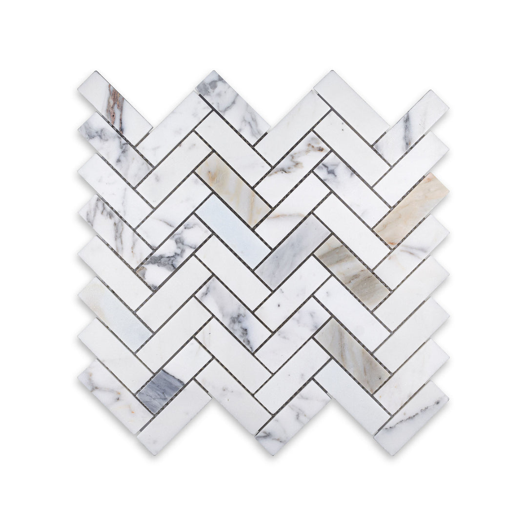 Top-down view of 1x3 herringbone mosaic in honed Calacatta Gold Marble, offering a graceful and contemporary take on a timeless layout.