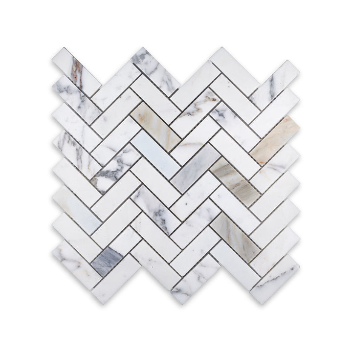 Top-down view of 1x3 herringbone mosaic in honed Calacatta Gold Marble, offering a graceful and contemporary take on a timeless layout.