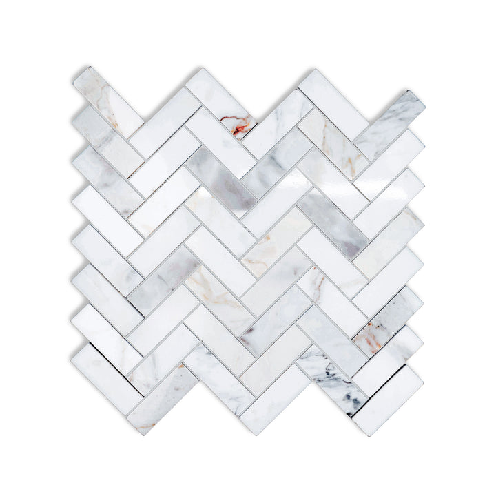 Polished Calacatta Gold Marble 1x3 herringbone mosaic seen from above, with sharp geometry and glossy finish that elevates any surface.