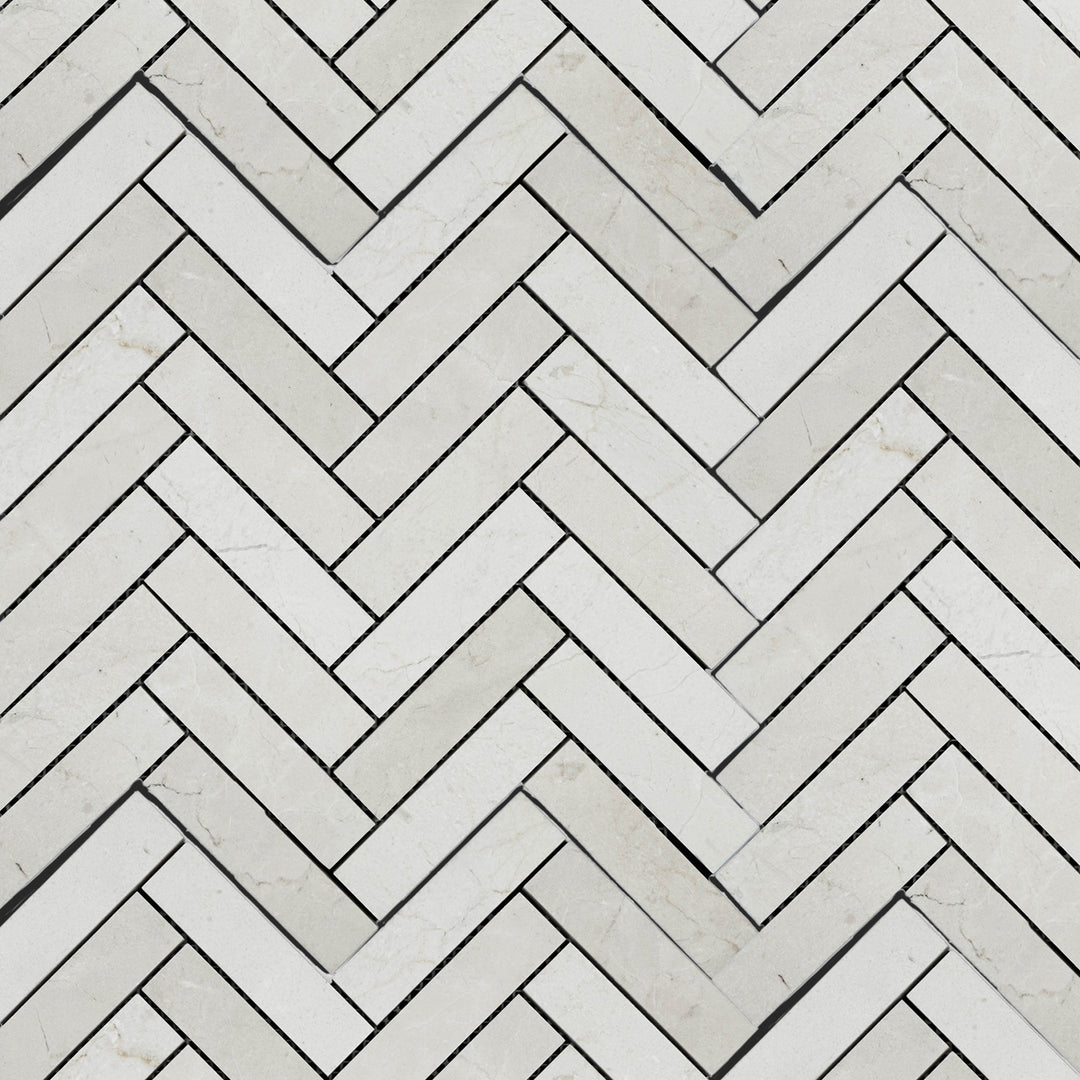 Full arrangement of Calacatta Gold Marble 1x4 polished herringbone mosaic showing glimmering finish and natural variation.