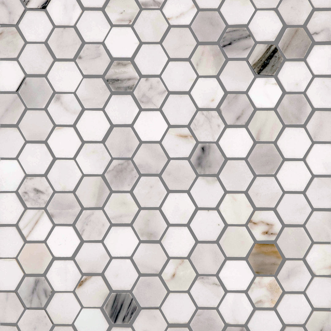 Overview image of Calacatta Gold Marble 1-Inch Hexagon Honed Mosaic, capturing the intricate hex pattern and soft honed finish in a clean white and gold colorway.