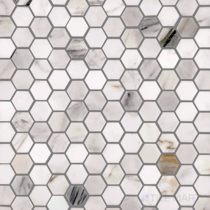 Full view of Calacatta Gold marble 1" hexagon polished mosaic, combining geometric style with rich veining in a polished finish.