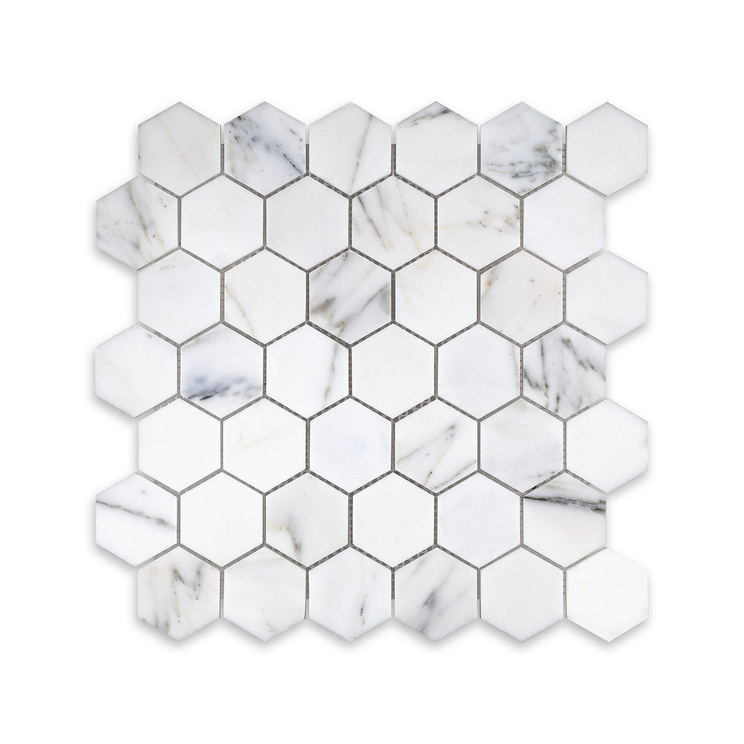 Overhead image of Calacatta Gold Marble 2 inch hexagon mosaic with a honed finish, offering clean geometric form and subtle golden veining.
