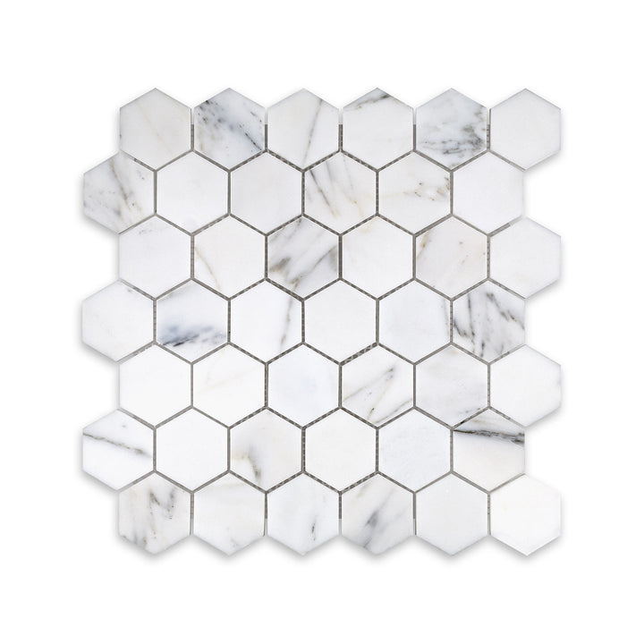 Overhead image of Calacatta Gold Marble 2 inch hexagon mosaic with a honed finish, offering clean geometric form and subtle golden veining.