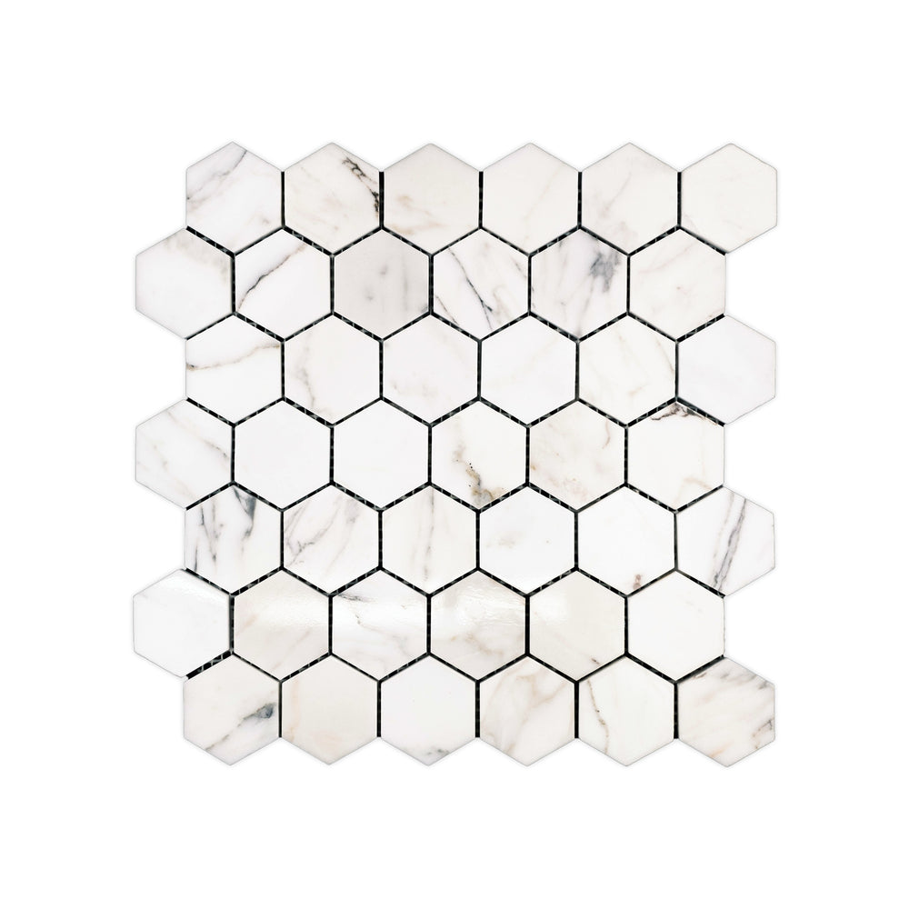 Polished Calacatta Gold Marble 2 inch hexagon mosaic viewed from above, displaying a glossy surface with rich natural marble detail.