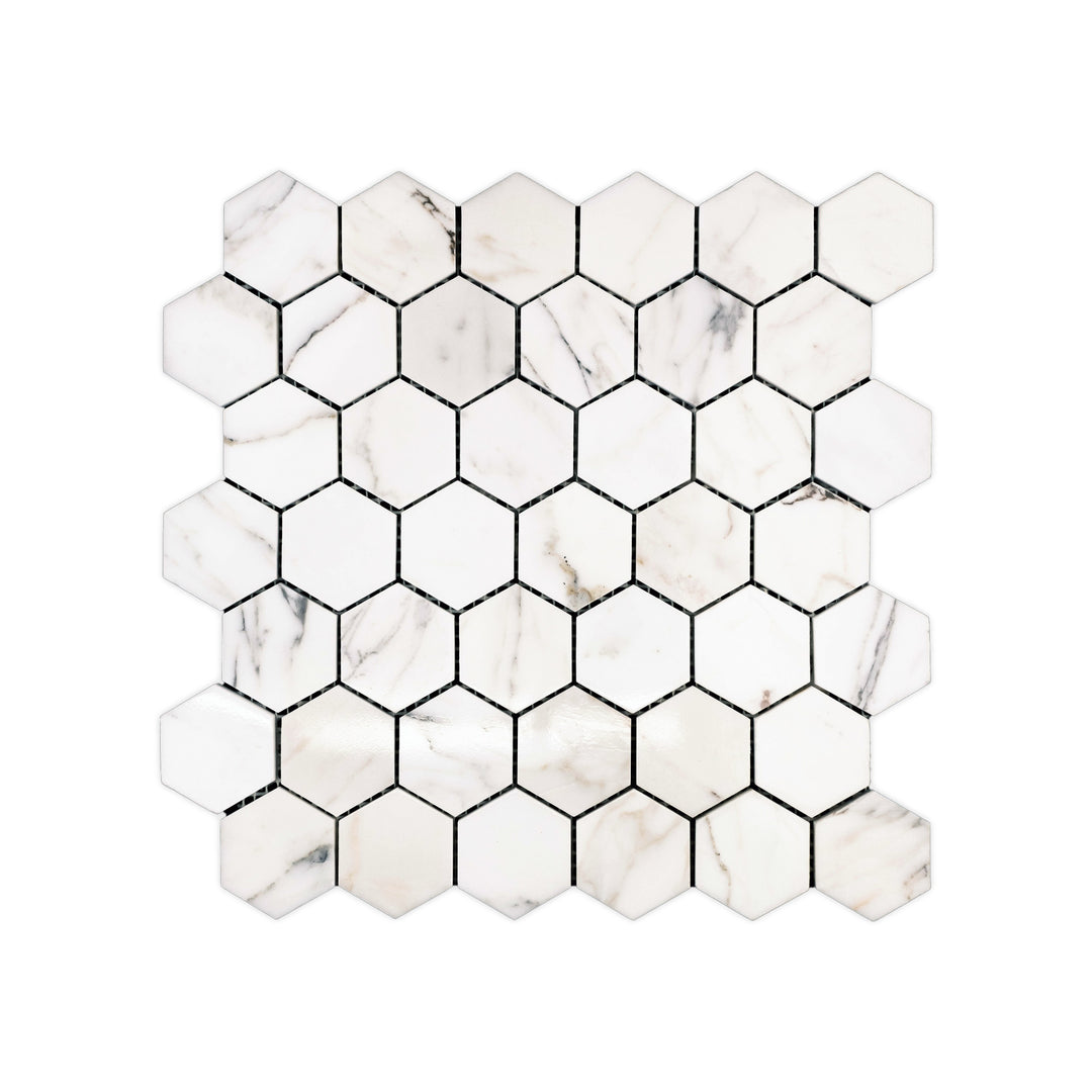 Polished Calacatta Gold Marble 2 inch hexagon mosaic viewed from above, displaying a glossy surface with rich natural marble detail.