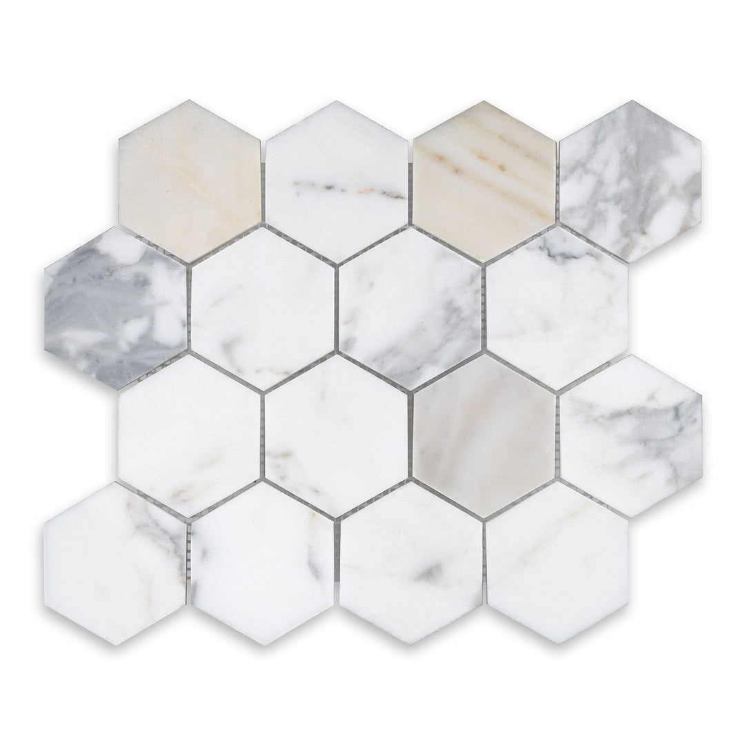 Seen from a top angle, this 3 inch hexagon mosaic in honed Calacatta Gold Marble presents a classic pattern with soft texture and elegant veining.
