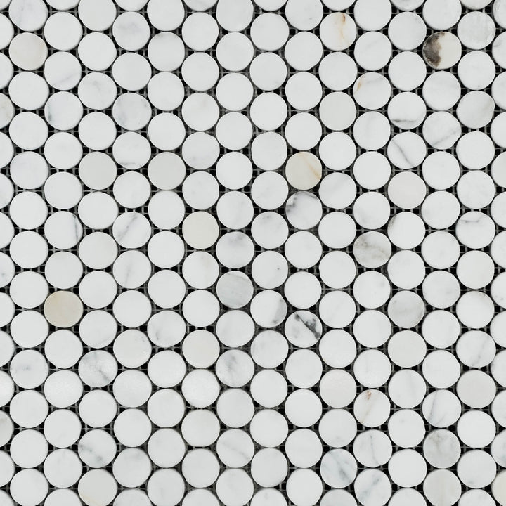 Polished penny round mosaic in Calacatta Gold Marble shown in full layout with brilliant sheen and warm veining.