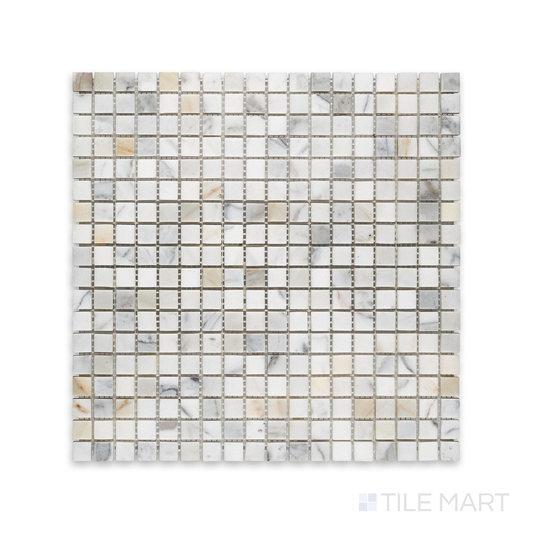 This 5/8 inch square mosaic in honed Calacatta Gold Marble is viewed from above, revealing tight grid layout and gentle matte finish.