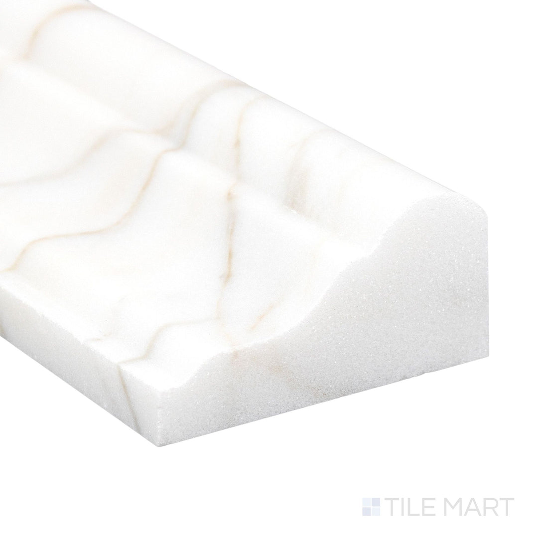 Corner detail of Calacatta Gold Marble 2x12 polished grand chair rail highlighting glossy finish and bold gold veining.