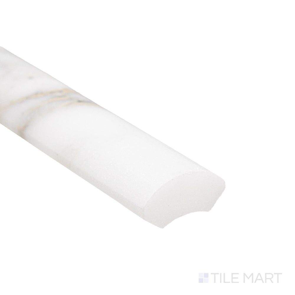 Corner close-up of Calacatta Gold Marble 1x12 honed quarter round showing curved matte edge and soft white tone.