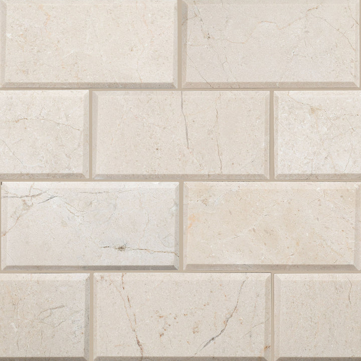 Beveled honed 3x6 Crema Marfil Classic Marble tiles shown in an angled edge format with a matte finish.