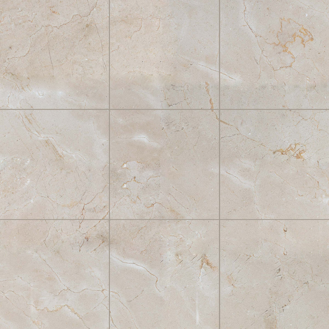 Overview of 12x12 honed Crema Marfil Classic Marble tiles arranged to showcase warm beige hues in a square grid.