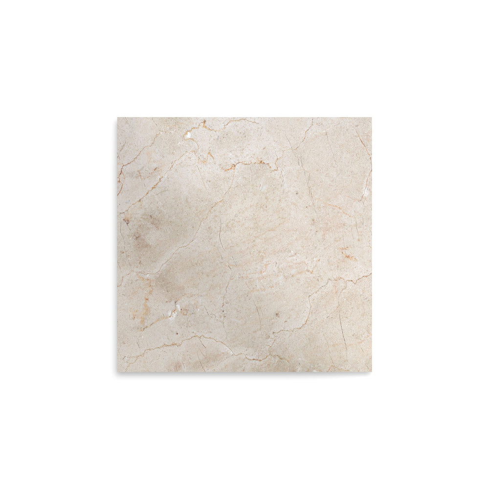 Overhead image of polished Crema Marfil Classic Marble 12x12 tile, showcasing a glossy surface with soft veining and classic neutral tones.