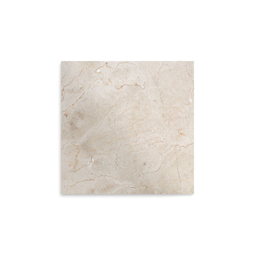 Overhead image of polished Crema Marfil Classic Marble 12x12 tile, showcasing a glossy surface with soft veining and classic neutral tones.