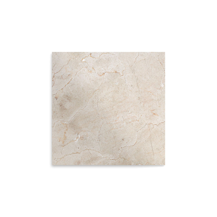 Overhead image of polished Crema Marfil Classic Marble 12x12 tile, showcasing a glossy surface with soft veining and classic neutral tones.