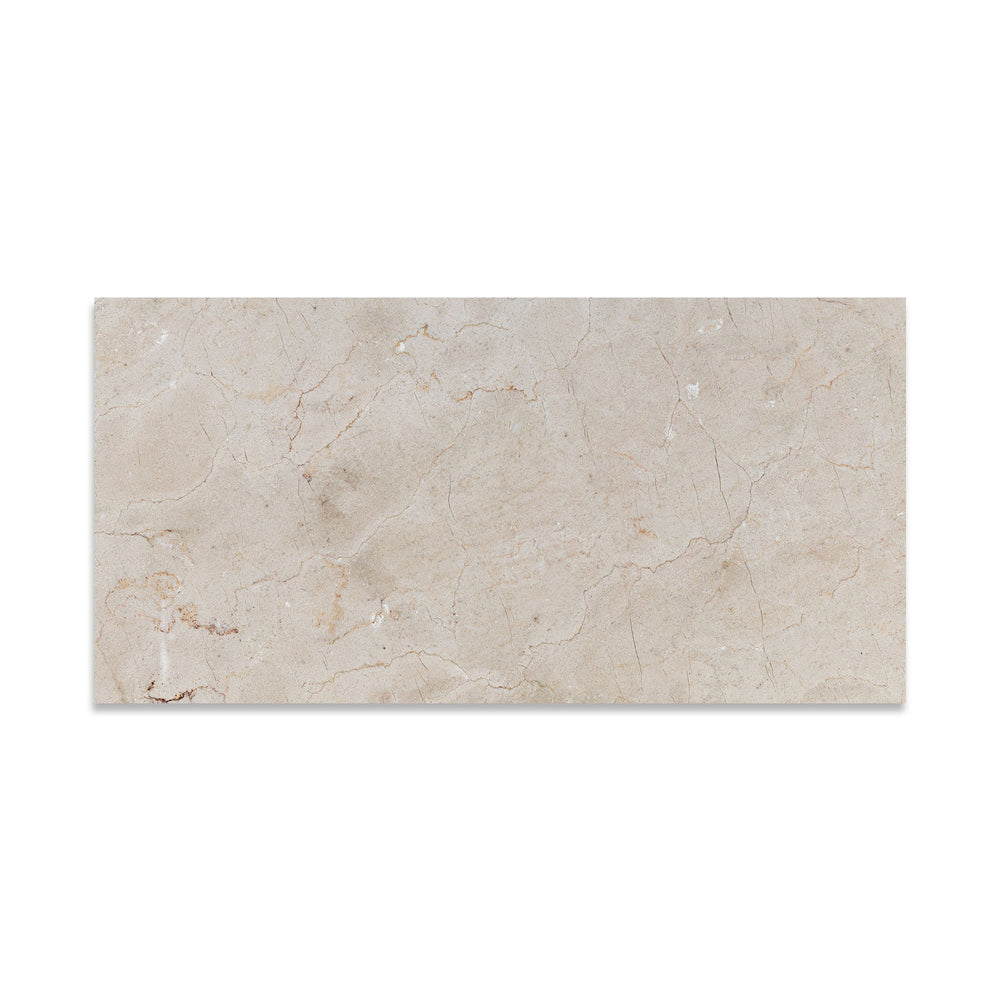Seen from above, this 12x24 Crema Marfil Classic Marble tile features a honed finish and extended rectangular format with subtle natural texture.
