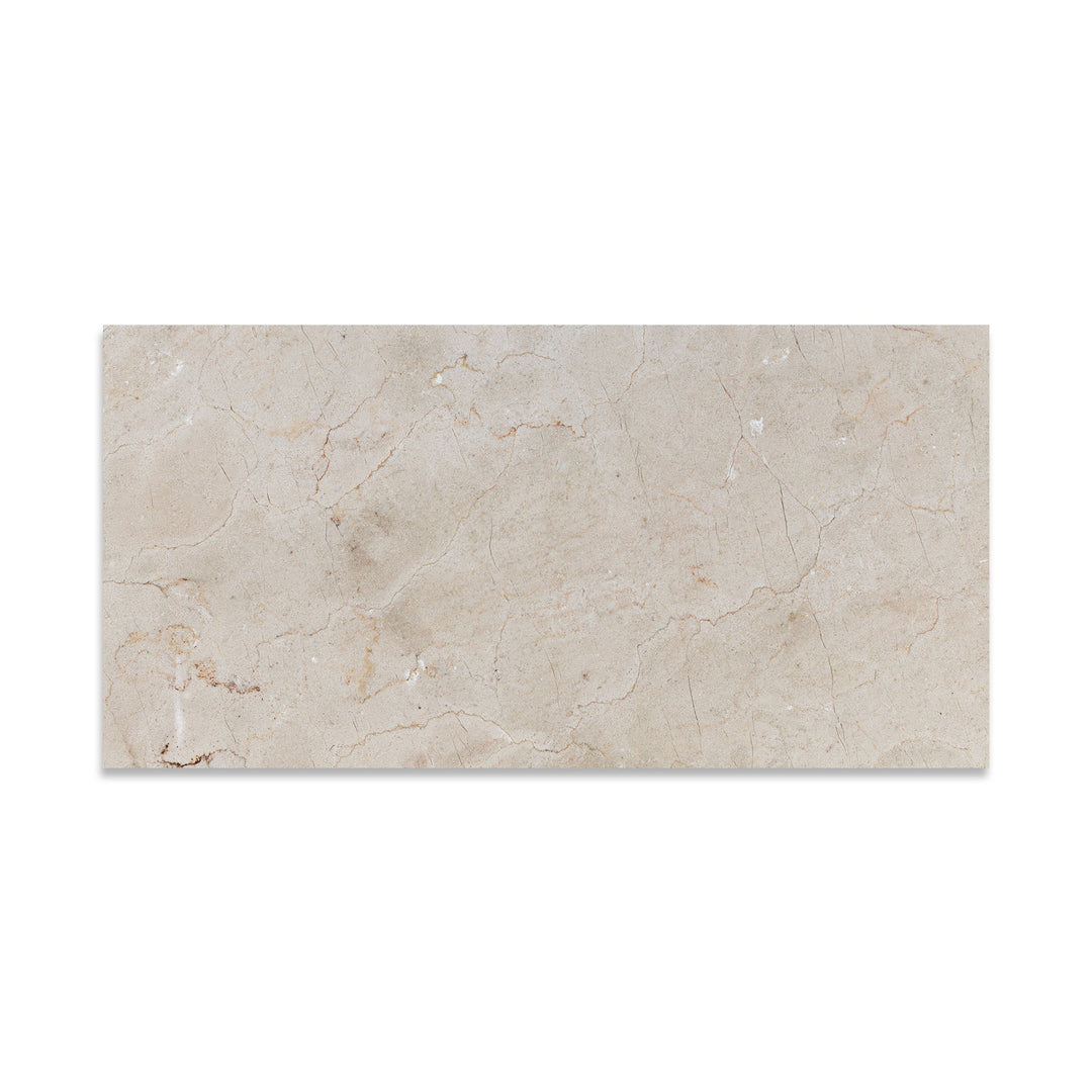 Seen from above, this 12x24 Crema Marfil Classic Marble tile features a honed finish and extended rectangular format with subtle natural texture.