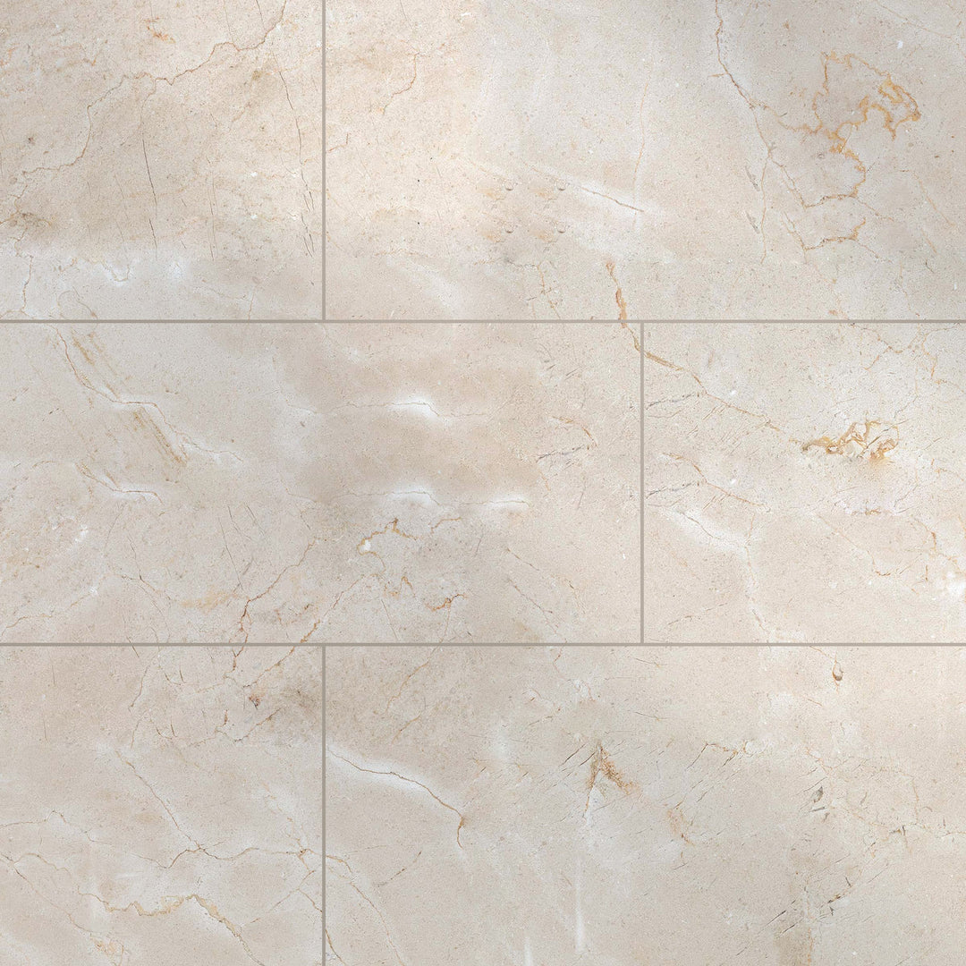Glossy 12x24 polished Crema Marfil Classic Marble tiles arranged to highlight the large-format shine and soft veining.