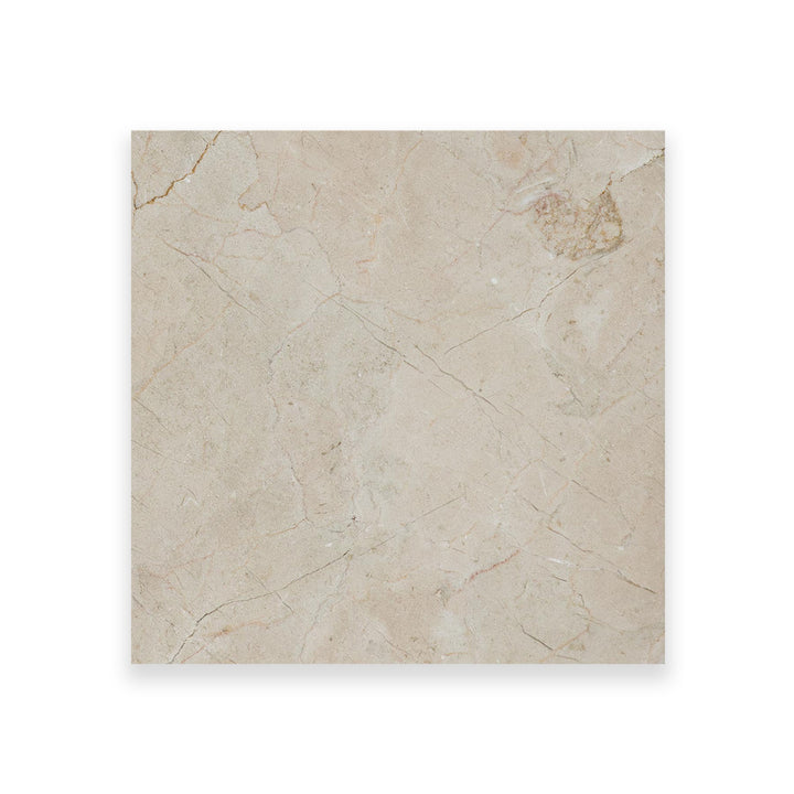 Overhead view of 18x18 polished Crema Marfil Classic Marble tile, revealing a high-sheen finish and warm, consistent veining throughout.