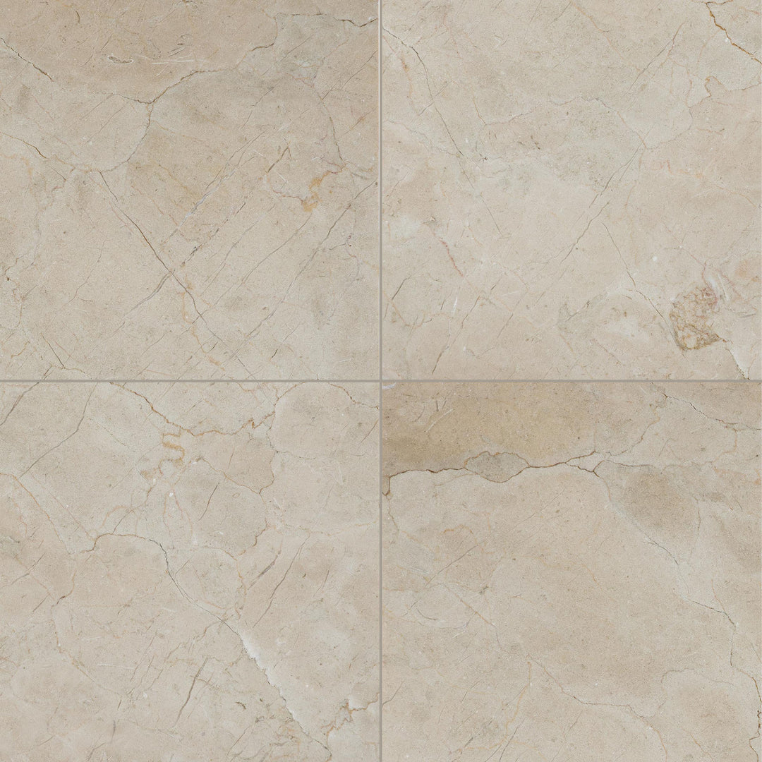 Overview of 24x24 honed Crema Marfil Classic Marble tiles with a matte surface and uniform stone pattern.
