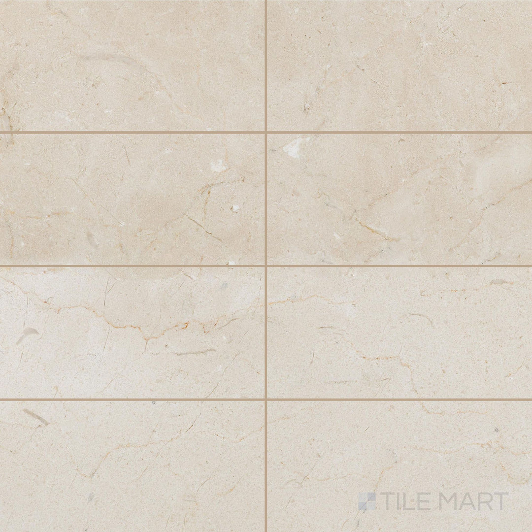 Honed 6x12 Crema Marfil Select Marble tiles laid in an offset pattern showing smooth finish and warm undertones.