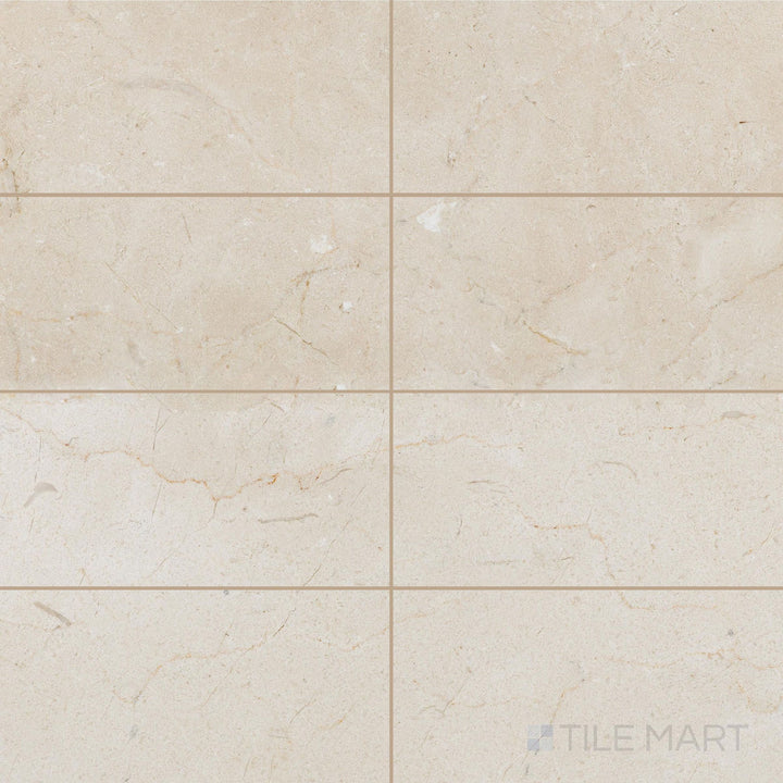 Honed 6x12 Crema Marfil Select Marble tiles laid in an offset pattern showing smooth finish and warm undertones.