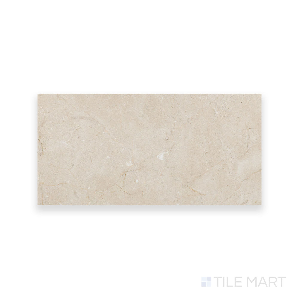 Honed Crema Marfil Select Marble 6x12 tile displayed from above, offering a refined matte texture and uniform warm color in a sleek rectangular shape.