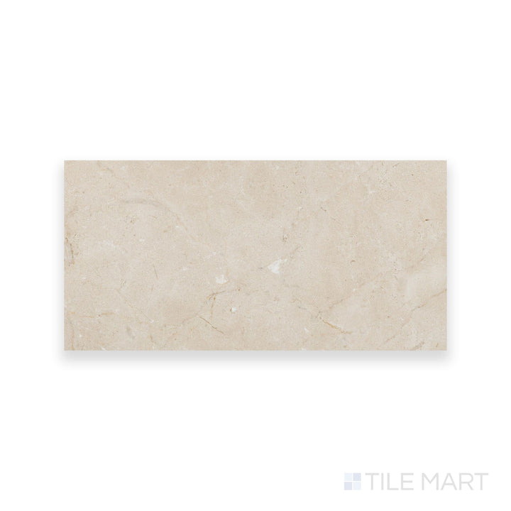 Honed Crema Marfil Select Marble 6x12 tile displayed from above, offering a refined matte texture and uniform warm color in a sleek rectangular shape.
