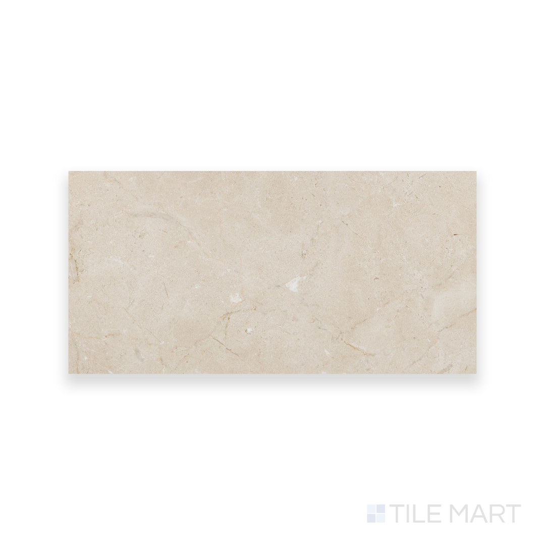 Honed Crema Marfil Select Marble 6x12 tile displayed from above, offering a refined matte texture and uniform warm color in a sleek rectangular shape.