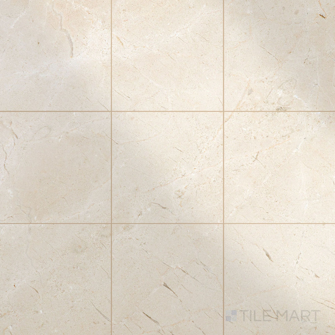 Glossy 12x12 polished Crema Marfil Select Marble tiles arranged to capture light and enhance classic stone texture.