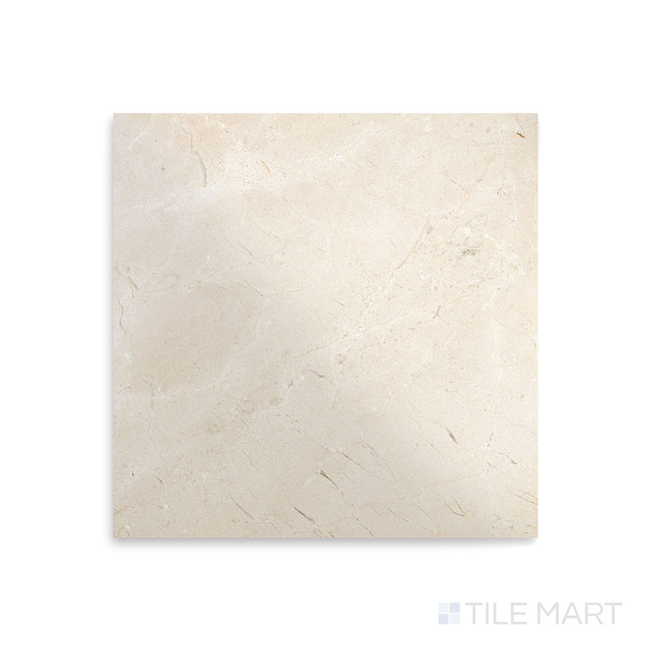 Polished Crema Marfil Select Marble tile in 12x12 format seen from above, revealing a lustrous finish with creamy tones and natural elegance.