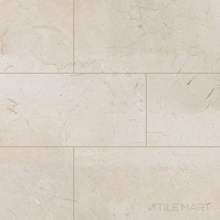 Overview of 12x24 honed Crema Marfil Select Marble tiles laid side by side showing a smooth matte appearance.