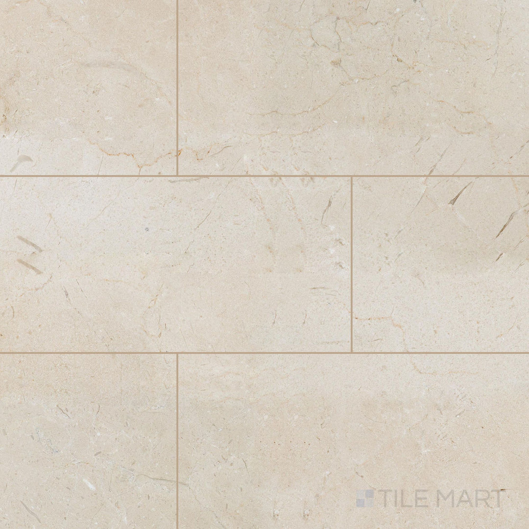 Overview of 12x24 honed Crema Marfil Select Marble tiles laid side by side showing a smooth matte appearance.