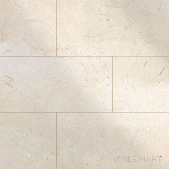 24x12 polished Crema Marfil Select Marble tiles in a clean layout highlighting shine and soft veining.