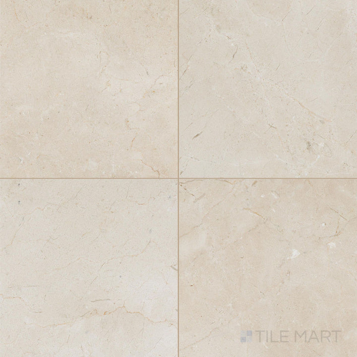 18x18 honed Crema Marfil Select Marble tiles placed in a neat square formation emphasizing muted beige tones.