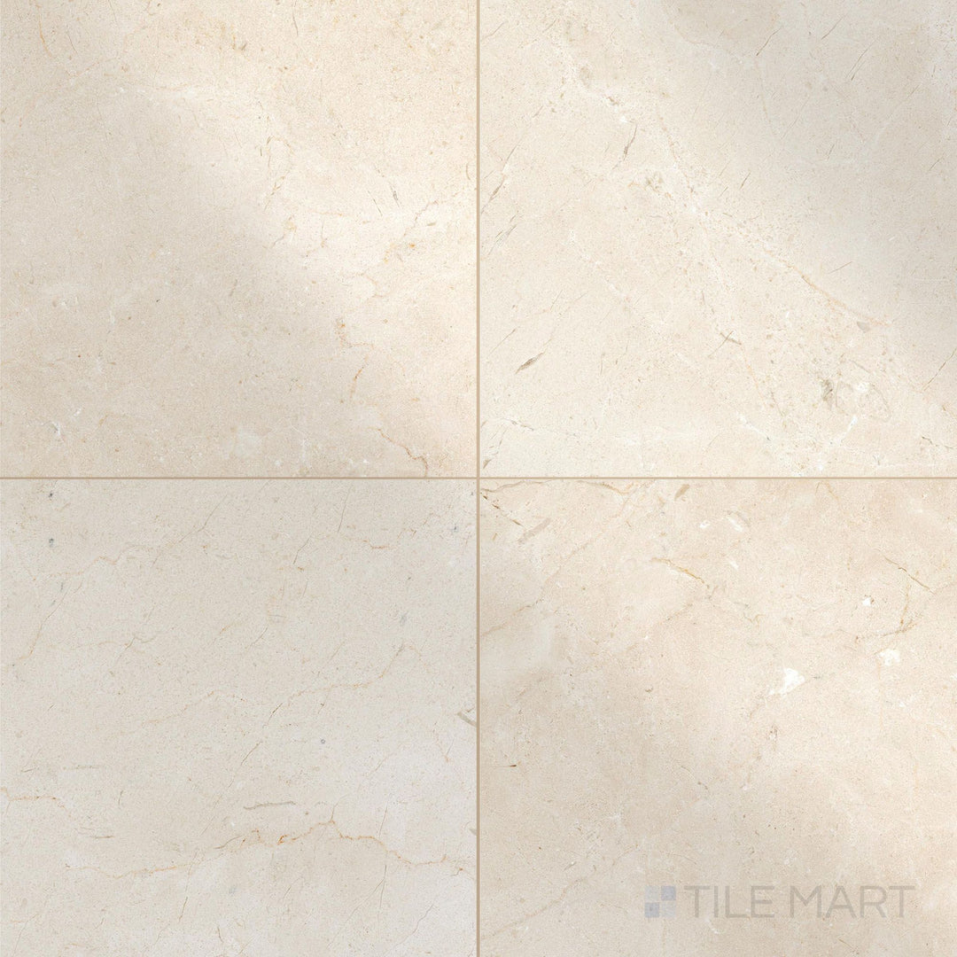 Polished 18x18 Crema Marfil Select Marble tiles in a top view grid showcasing surface sheen and uniformity.