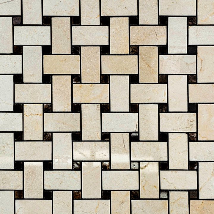 Basketweave polished mosaic of Crema Marfil Marble with brown dot inserts presented in an arranged format that enhances gloss and structure.