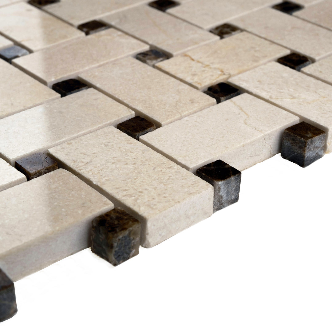 Polished basketweave Crema Marfil mosaic with brown dot detailing viewed at an angle, emphasizing its glossy finish and classic patterning.