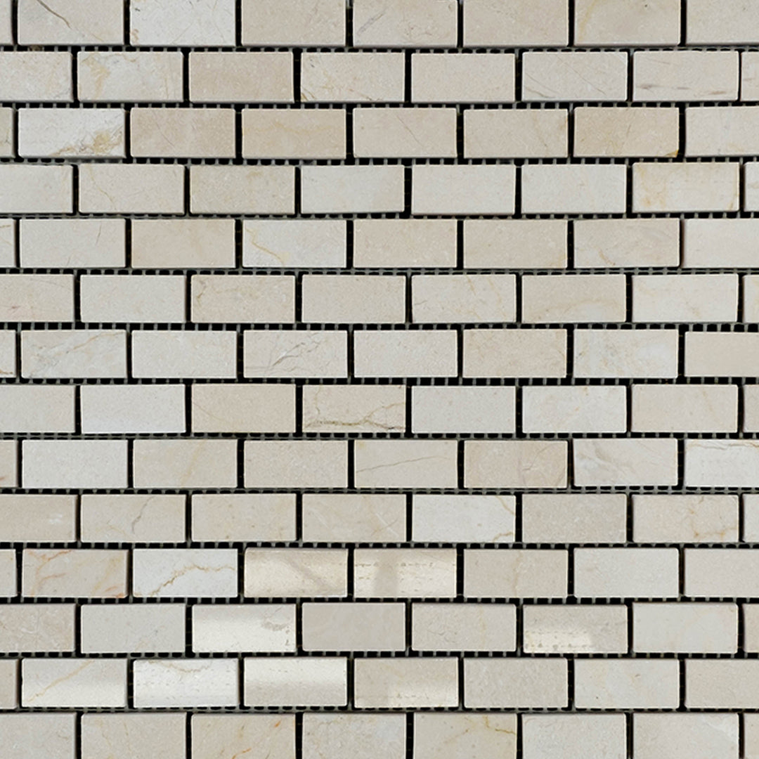 Polished Crema Marfil Marble brick mosaic in 5/8x1-1/4 format, neatly displayed to show reflective surface and compact rectangular design.