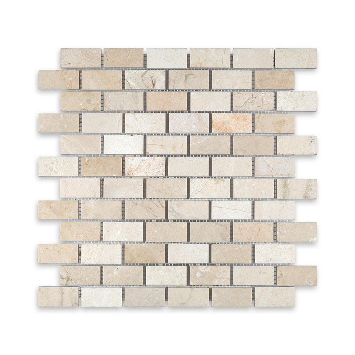 Overhead image of Crema Marfil Marble 1x2 brick mosaic in honed finish, featuring a smooth matte texture and classic beige coloration in a traditional layout.