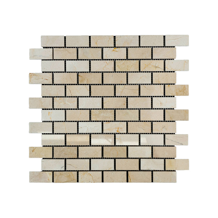 Polished 1x2 Crema Marfil Marble brick mosaic viewed from above, offering glossy surfaces with rich beige tones and soft marble veining.