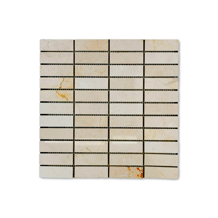 Overhead shot of polished 1x3 stacked Crema Marfil Marble mosaic, highlighting vertical alignment and a glossy beige finish for modern surfaces.