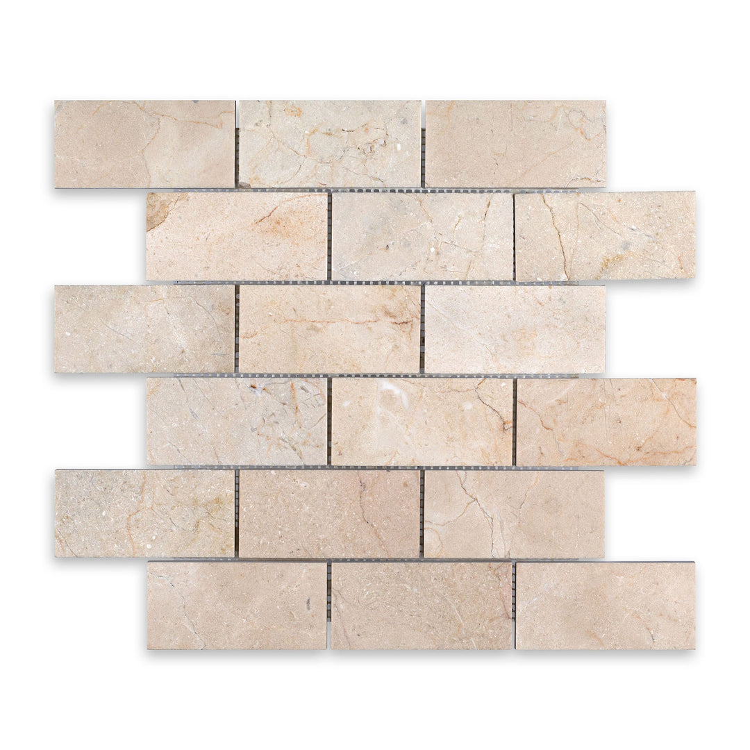 Crema Marfil Marble 2x4 brick mosaic in honed finish shown from a top-down view, offering a balanced pattern with natural tones and a smooth surface.