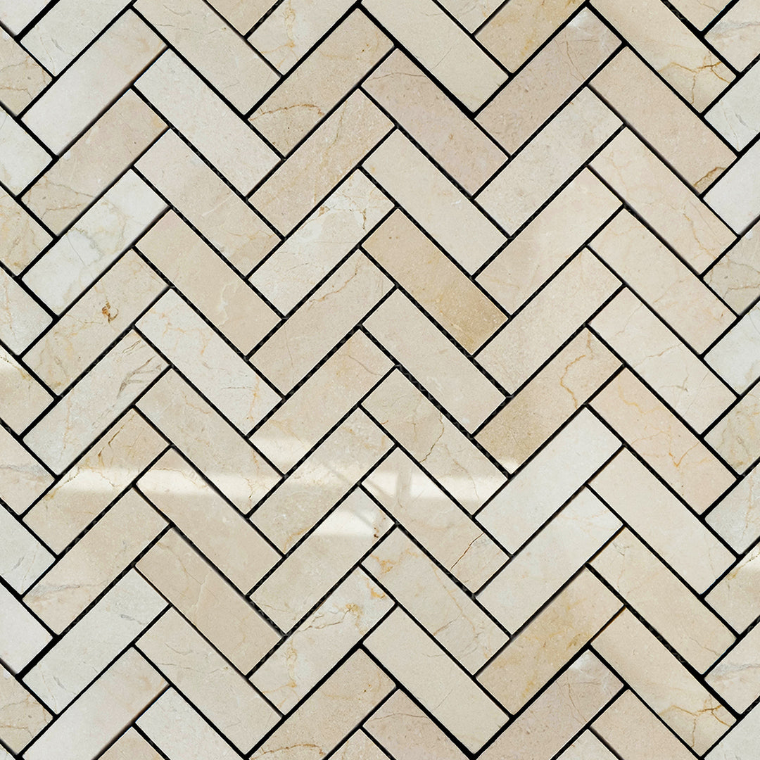 Polished 1x3 herringbone mosaic overview made of Crema Marfil Marble with a gleaming finish and classic stone veining.
